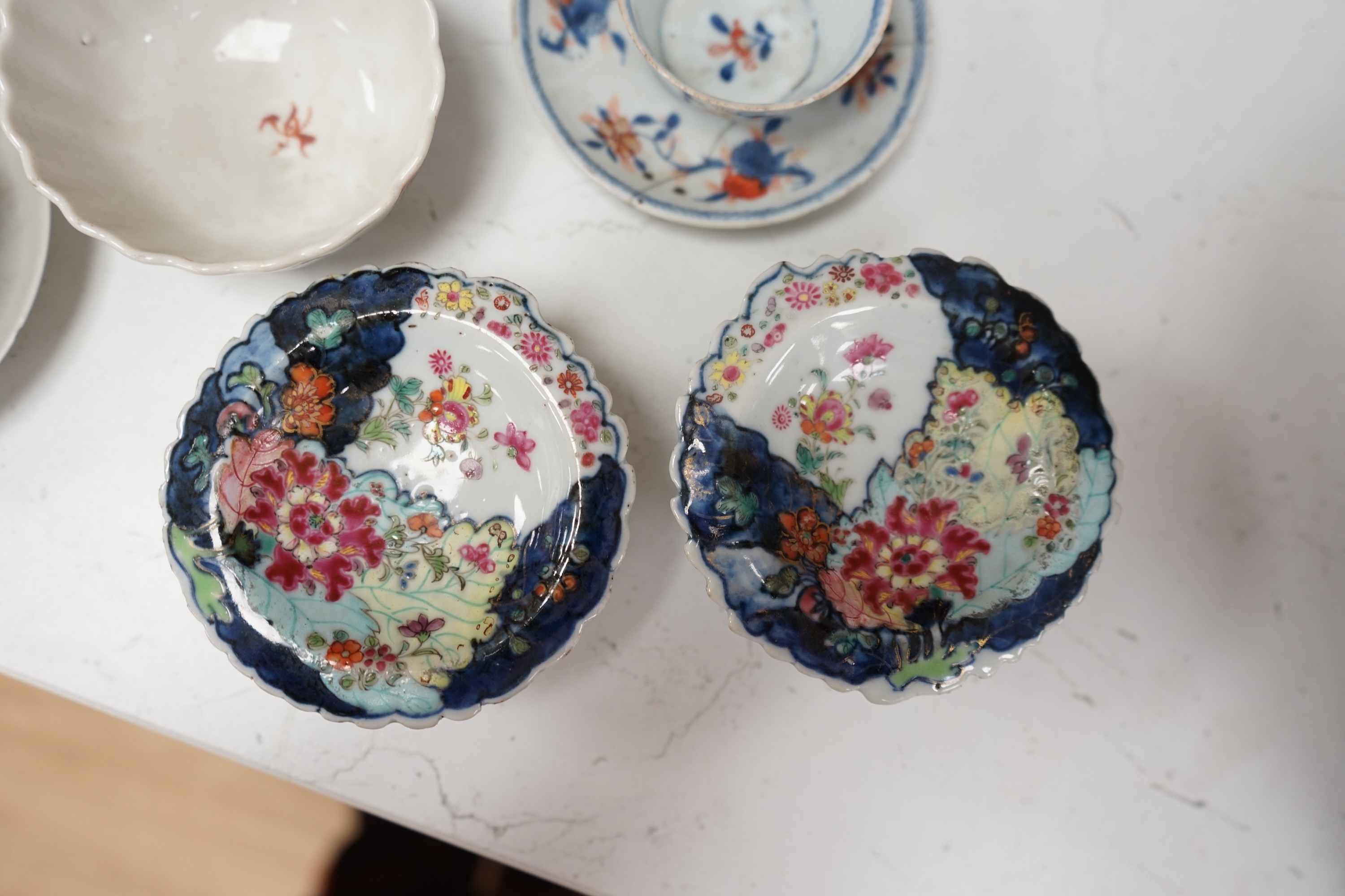 A pair of 18th century Chinese export tobacco leaf pattern pedestal salts, a clobbered Chinese dish (a.f.), now mounted with gilt metal rim, etc., 41cm diameter, together with four 18th century Chinese tea bowls, and thr